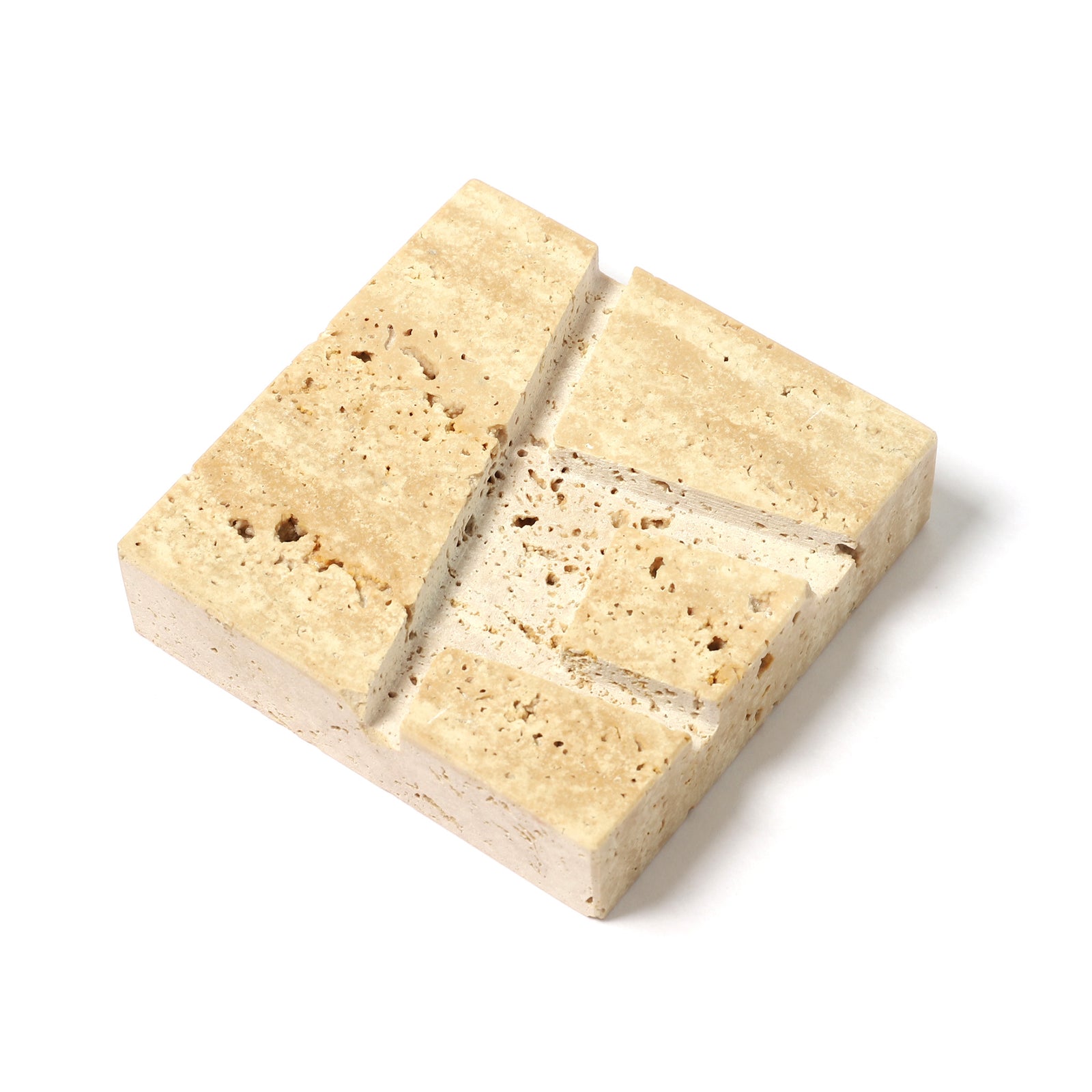 A square travertine stone tile sample with a natural porous texture, showing beige and cream layers with brown speckles, isolated on a white background.