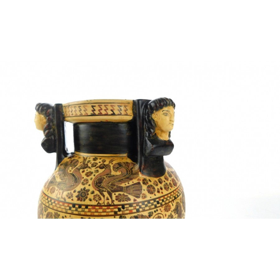 A ceramic replica of a vase with animal frieze designs.