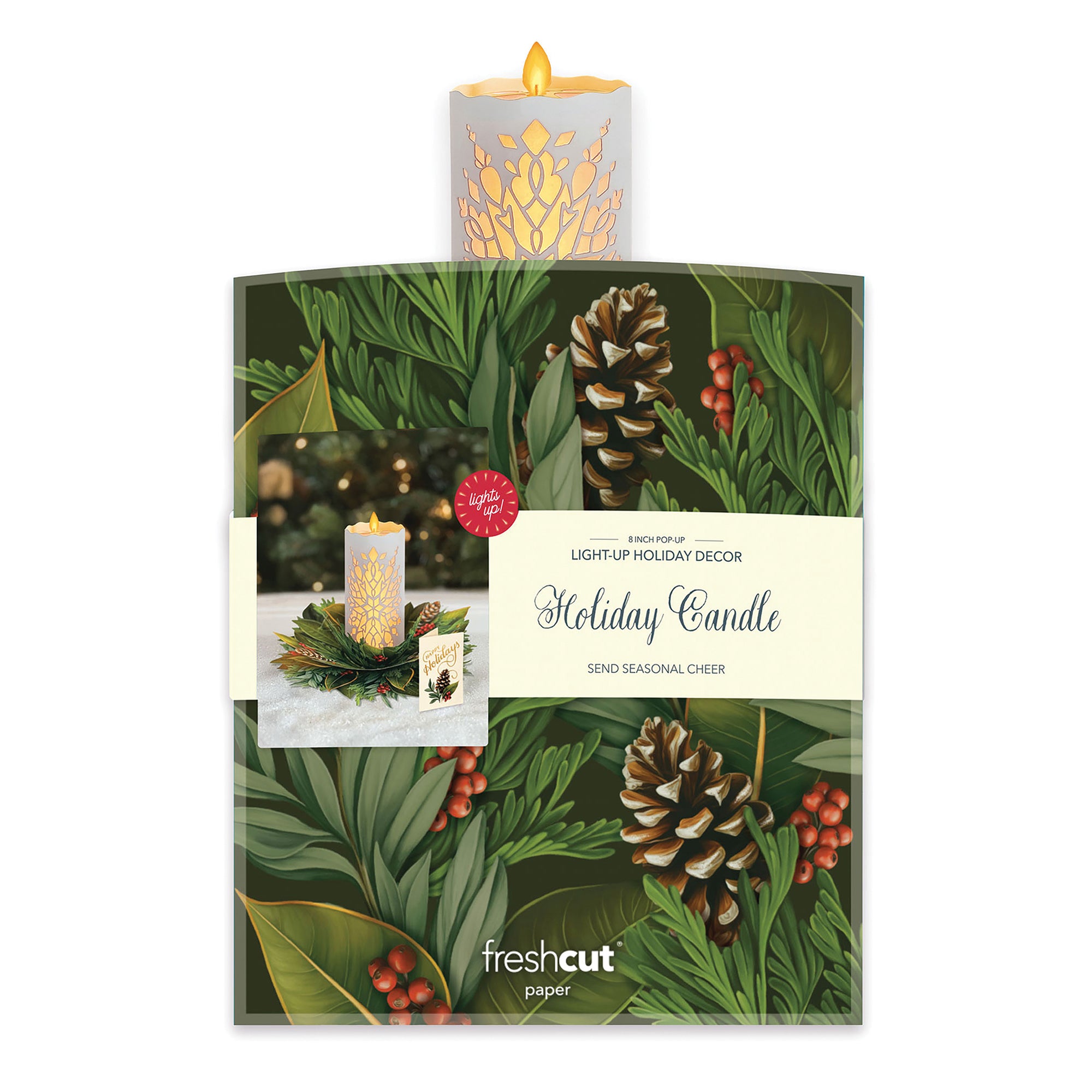 Light-up holiday candle with decorative packaging featuring greenery and pinecones.