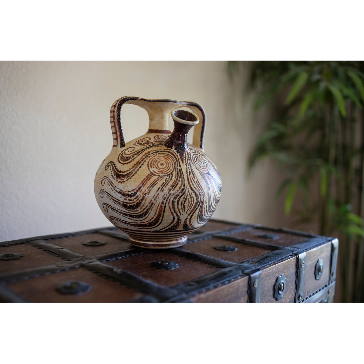 Ceramic vase with decorative patterns on a wooden chest