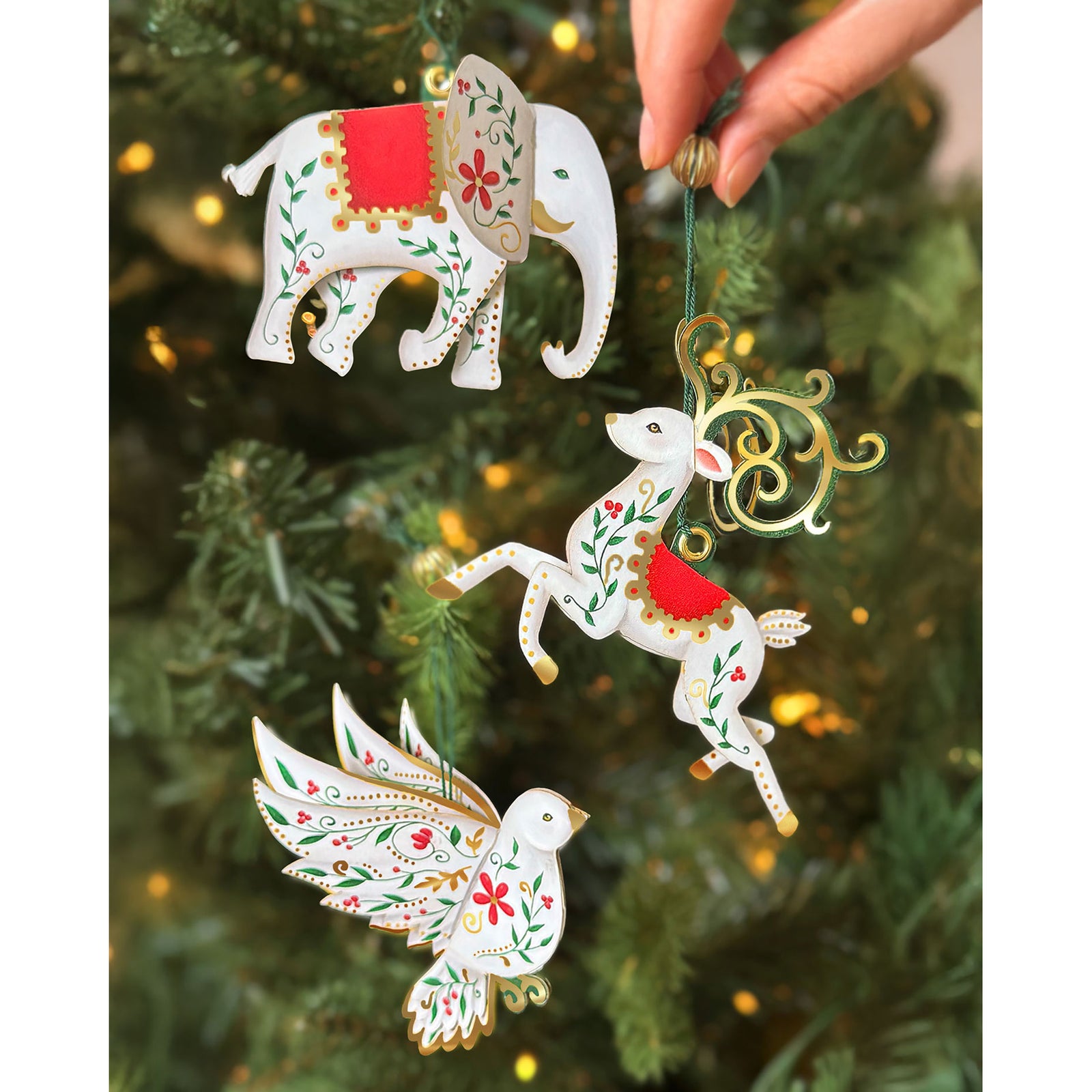 Enchanted Forest advent calendar packaging with Christmas ornaments in the background