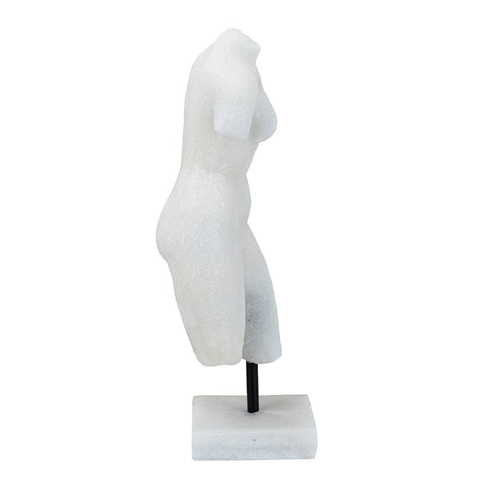 White marble sculpture of a draped figure on a white background
