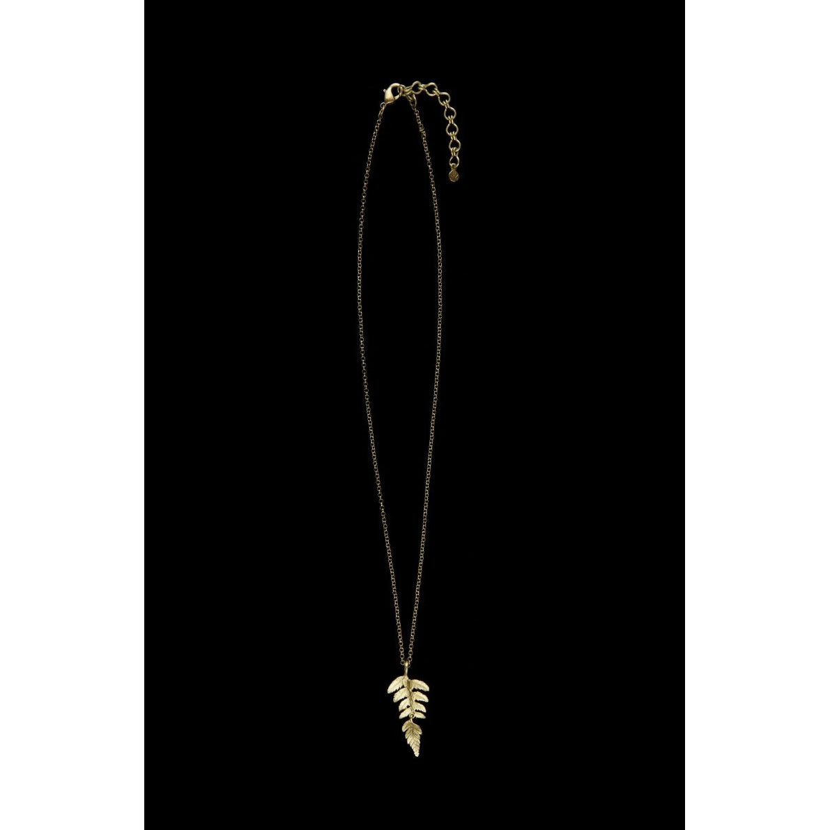 Leaf pendant necklace on a black background