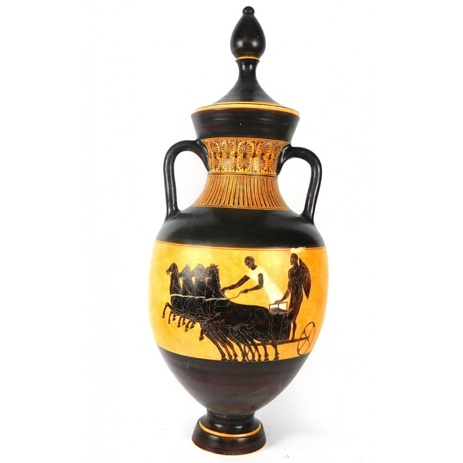 Decorative vase with black and gold design on a white background