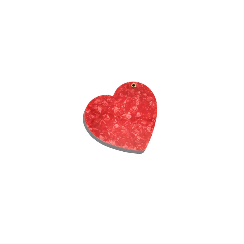 Red heart-shaped object on a white background