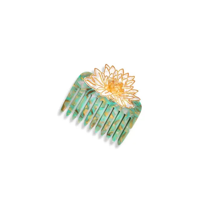 Decorative comb with a floral design on a white background