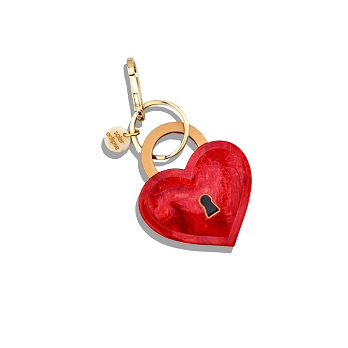 Red heart-shaped lock keychain with gold accents on a white background