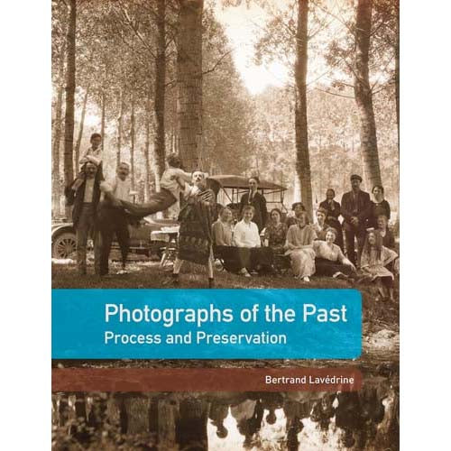 Book cover for 'Photographs of the Past: Process and Preservation' by Bertrand Lavédine, featuring a sepia-toned vintage group photo in a forest with a car and a bright blue title banner across the lower middle.