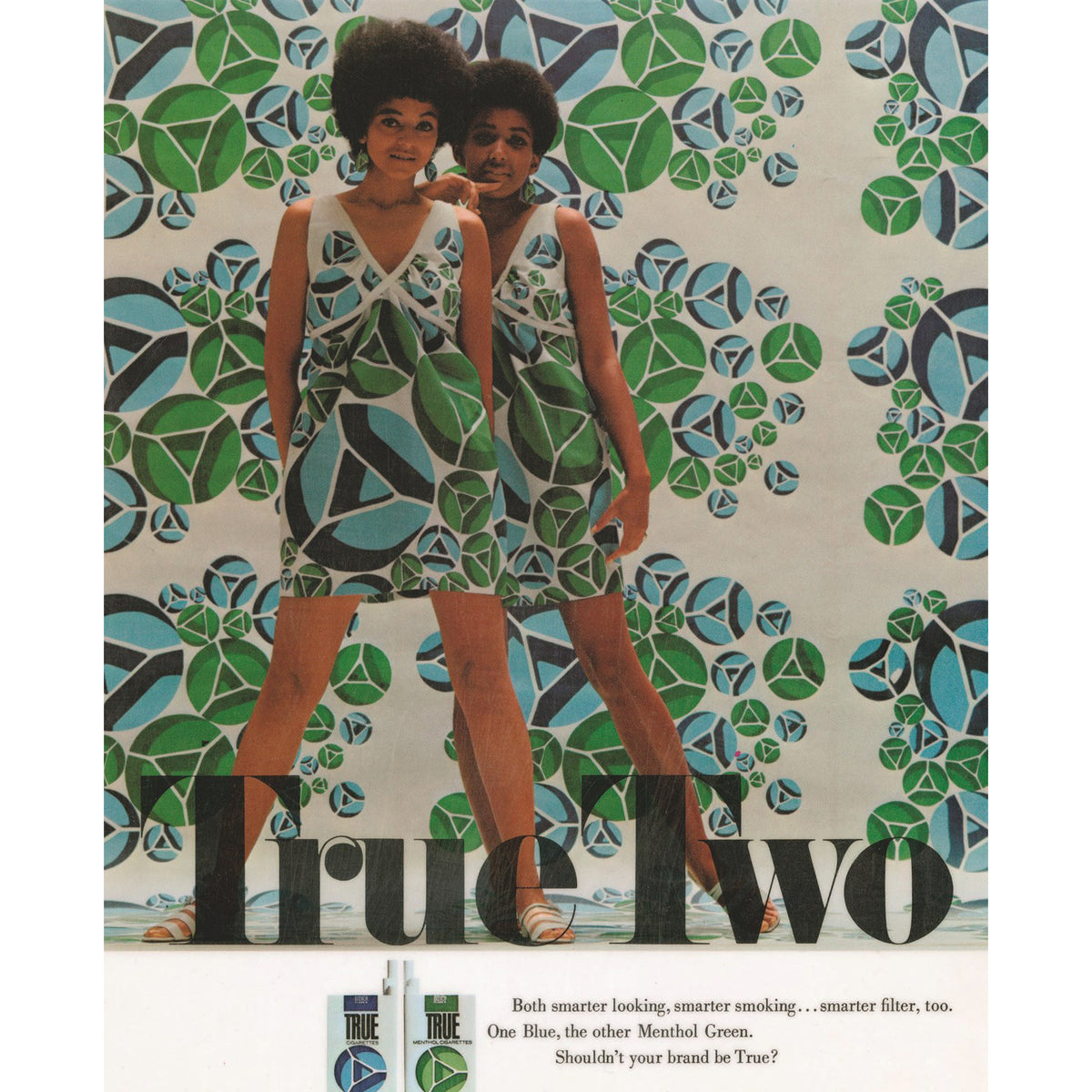 Vintage True Two cigarette advertisement featuring two women in matching blue, green, and white geometric-patterned mini dresses, with large 'True Two' text and product packaging shown at the bottom.