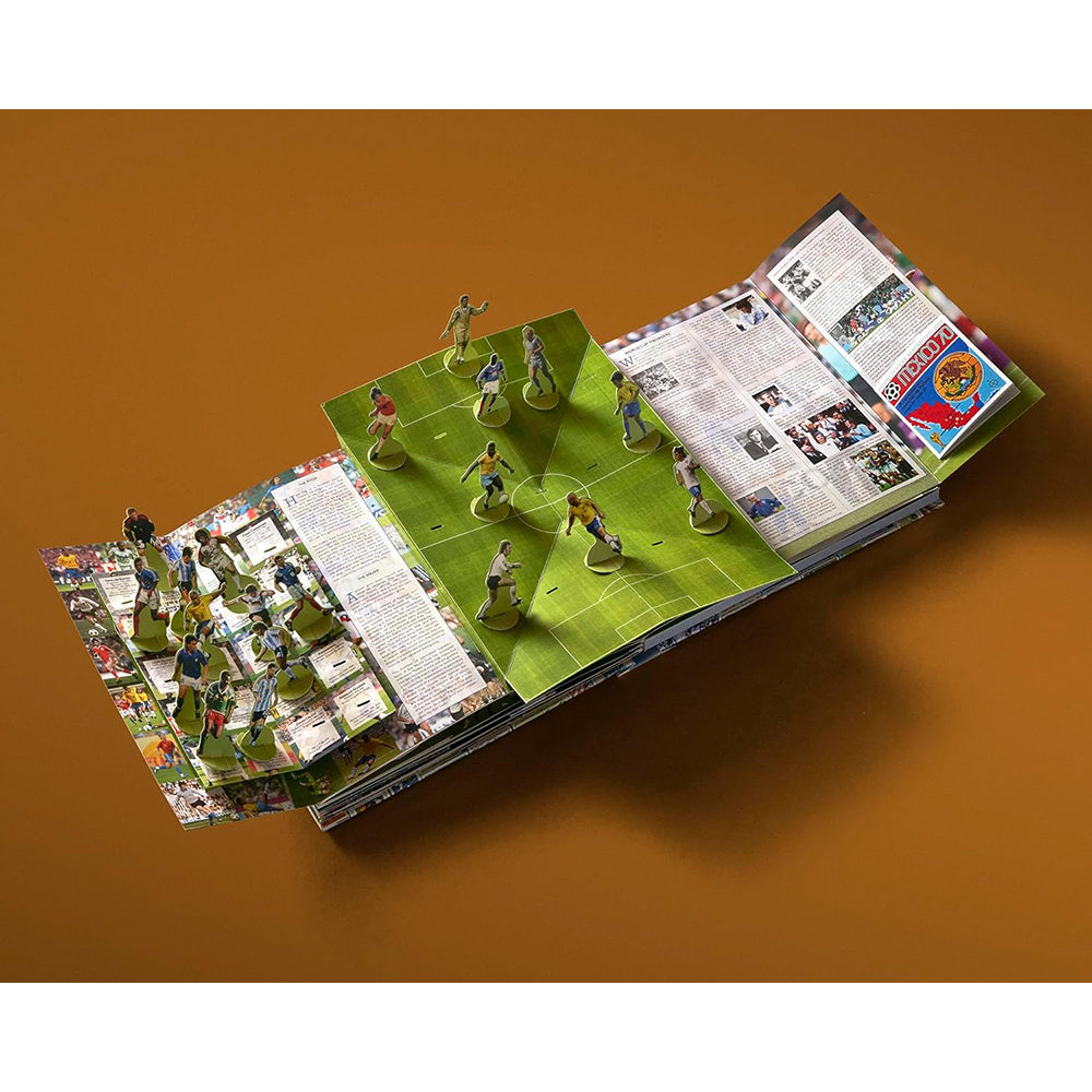 Board game with player figures on a green field and rules sheet on an orange background