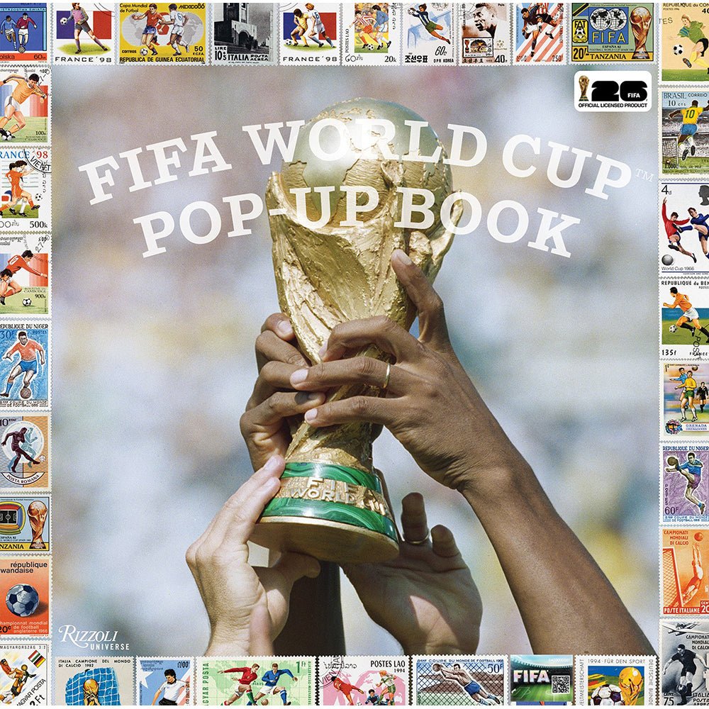Cover of FIFA World Cup pop-up book with hands holding the trophy and soccer-themed illustrations.
