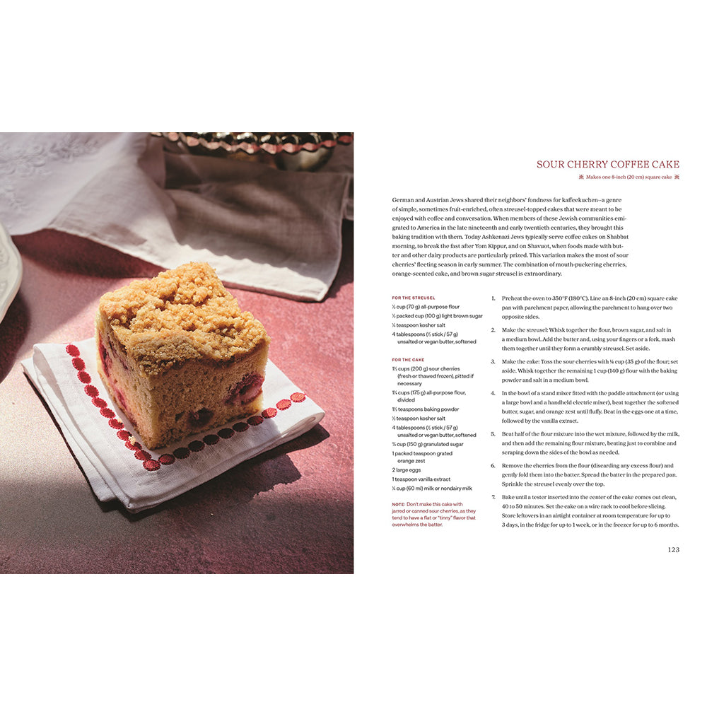 A printed recipe spread page featuring a photo of a slice of sour cherry coffee cake on the left and recipe text on the right, titled 'SOUR CHERRY COFFEE CAKE.'.