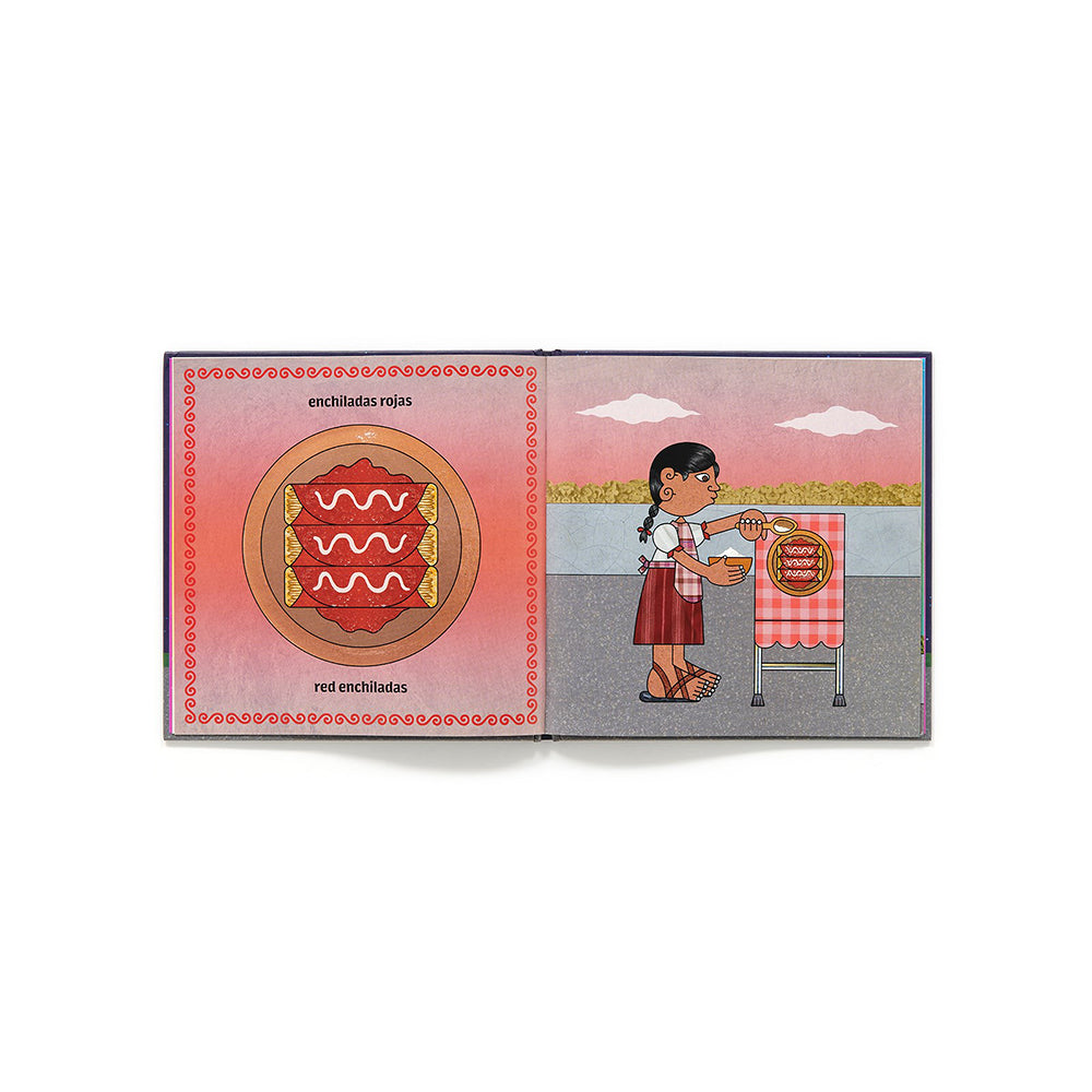 An open children's picture book spread showing a Spanish educational page about 'enchiladas rojas' and 'red enchiladas'. The left page features a circular enchilada illustration with red cheese slices, and the right page shows an illustrated girl serving enchiladas from a red-and-white checkered table.