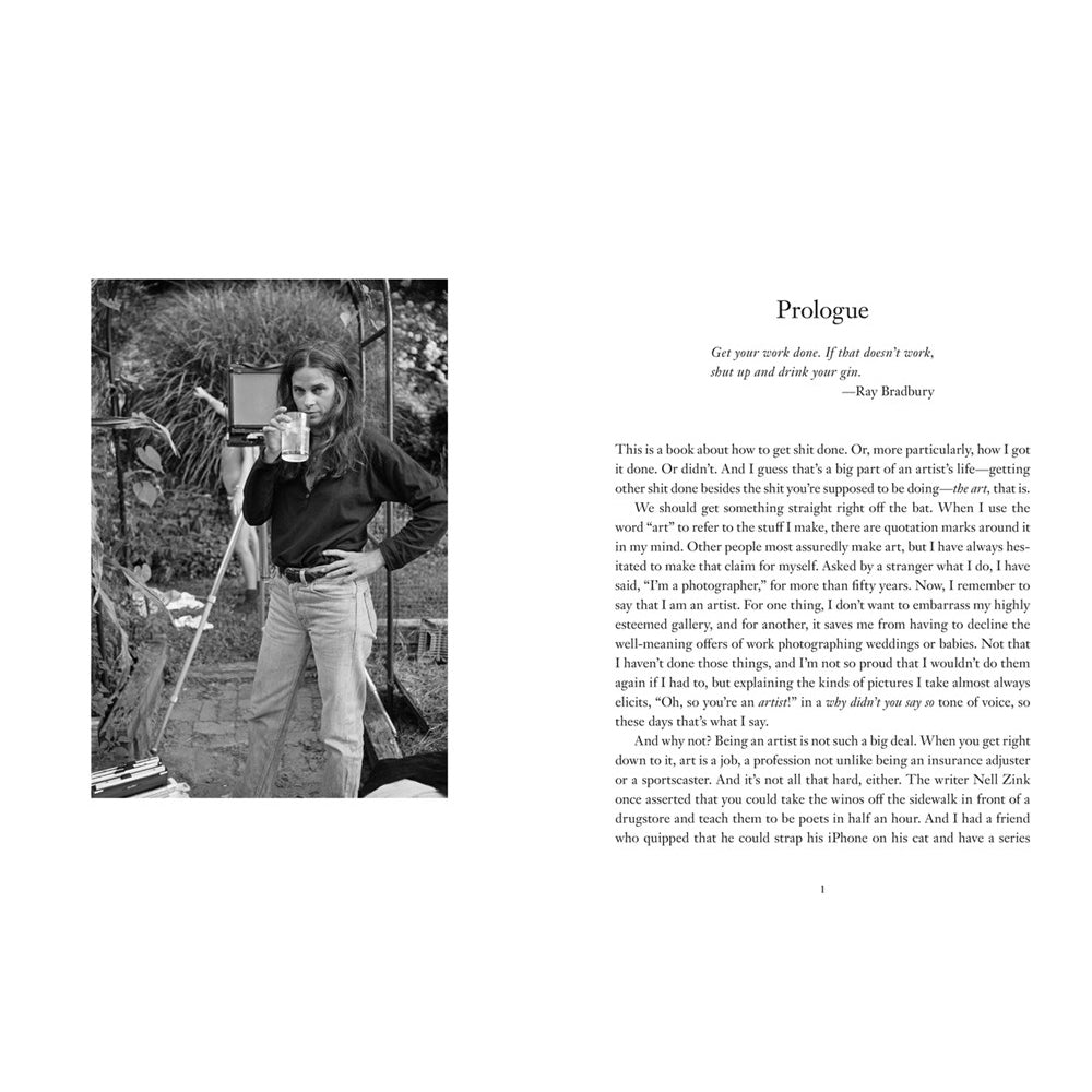 Book page with a black and white photo of a person holding a camera and text on a white background.