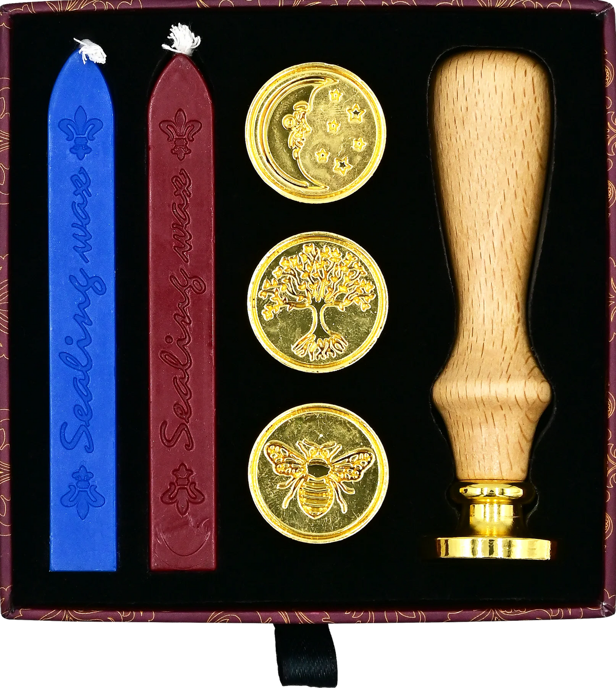 Wax seal set with three stamps and a wooden handle in a decorative box.