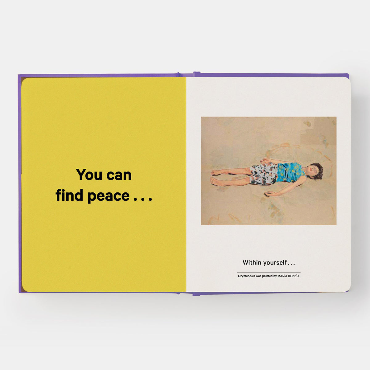 Open book with a yellow page and a photo of a person lying down on a white background.