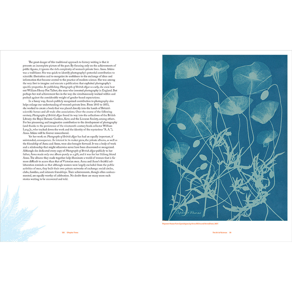 Book page with text and a blue and white solar print of plant life on a white background