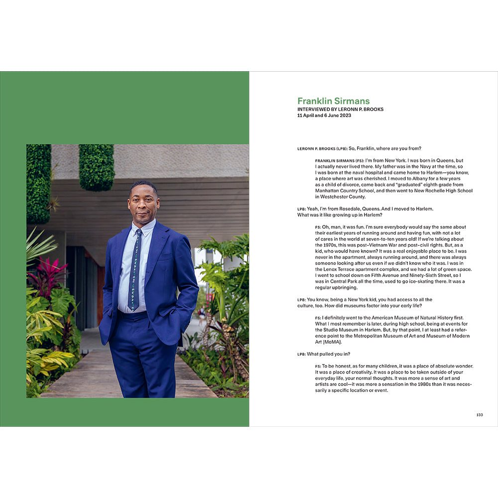 Man in a blue suit standing outdoors with text on a white background