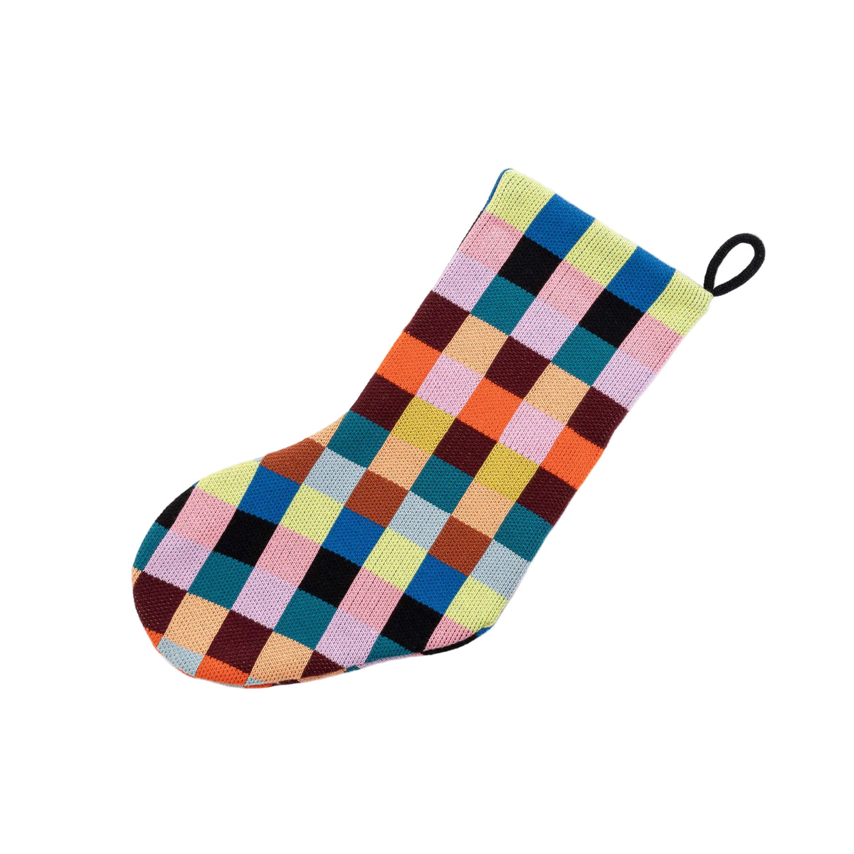 A single knit Christmas stocking with a colorful patchwork check pattern, featuring a black hanging loop at the top, shown on a light gray background.