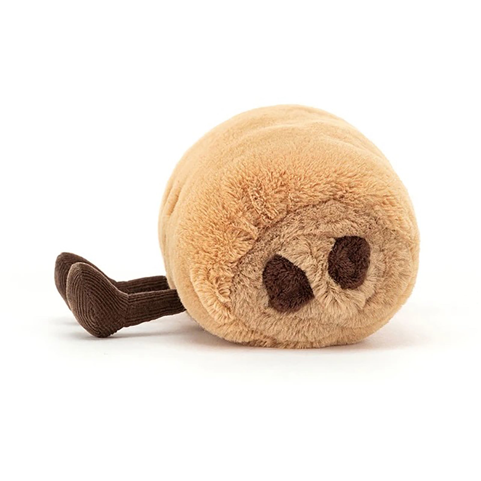 A plush toy shaped like a pastry, made of soft tan faux fur with a stitched smiling face and brown corduroy legs, photographed on a clean white background.