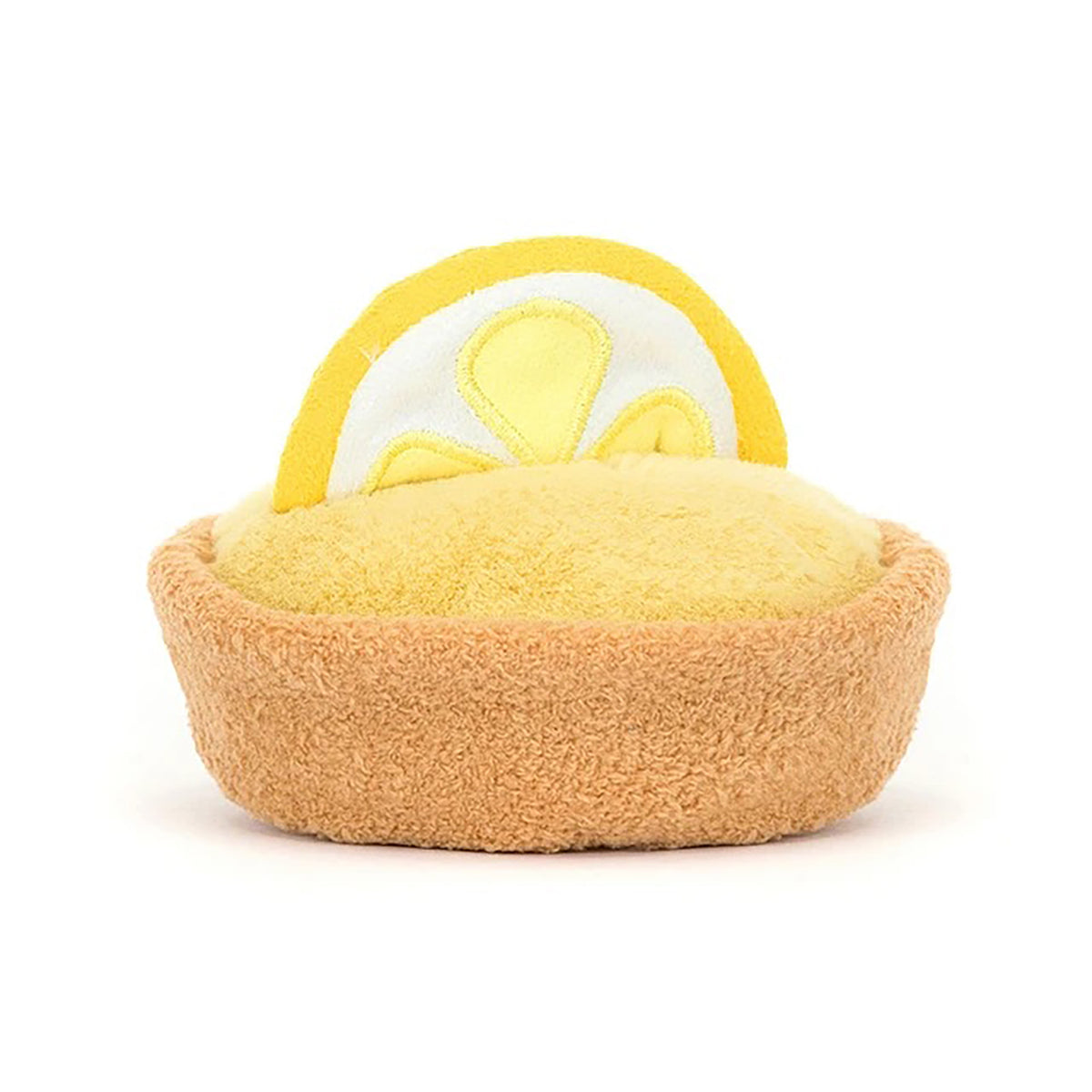 Toy resembling a lemon tart with a yellow top and brown crust on a white background
