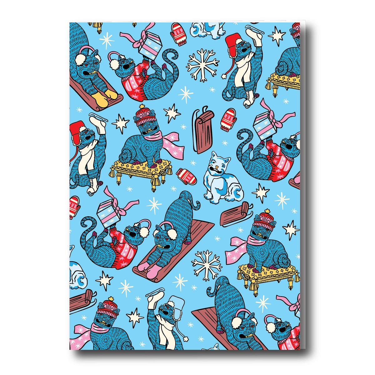 Patterned paper with cartoon cats in winter attire on a blue background