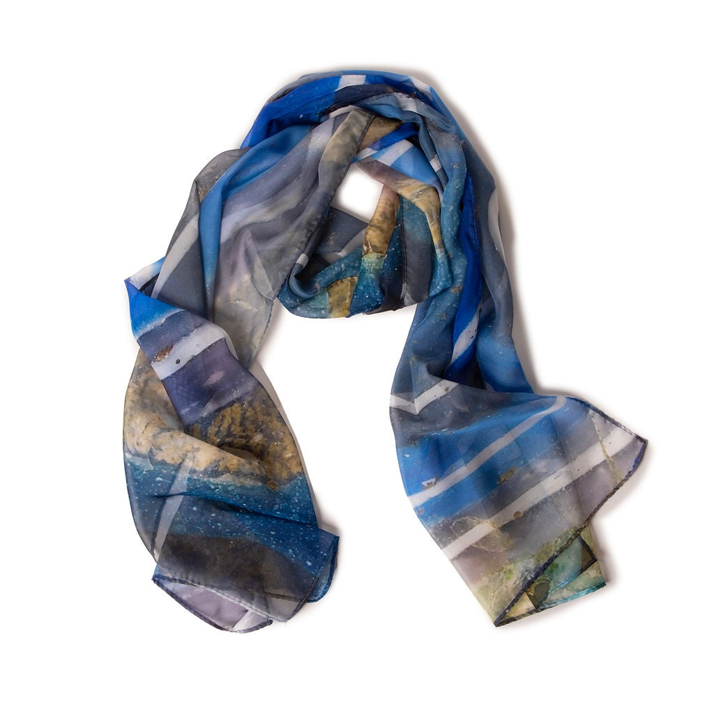 Blue and gray patterned scarf on a white background