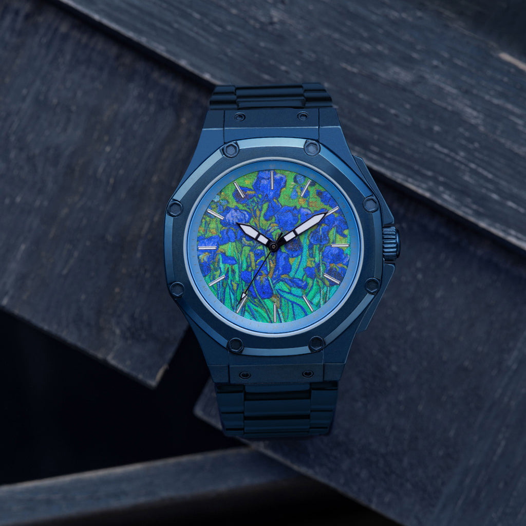 Blue watch with a floral pattern on a dark textured background