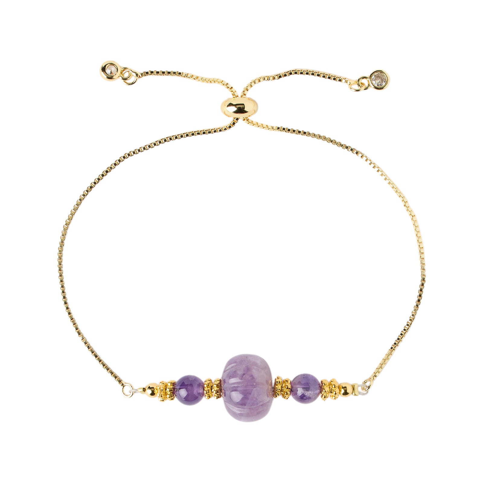 Gold bracelet with purple beads on a white background