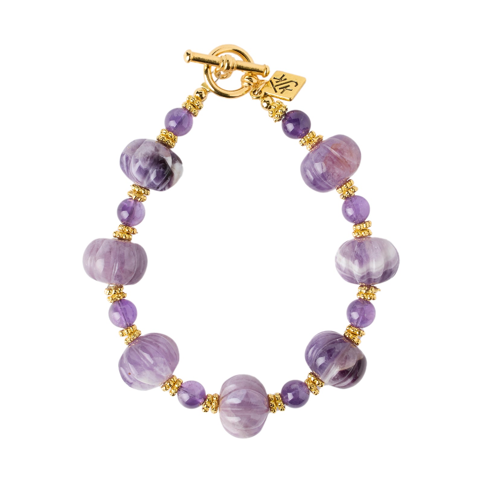 Purple beaded bracelet with gold accents on a white background