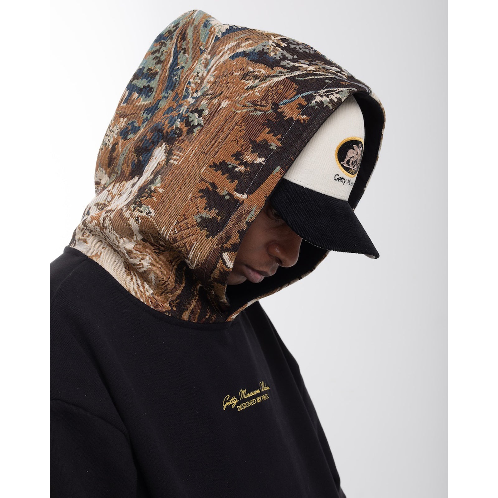 Black hoodie with a tapestry hood on a white background
