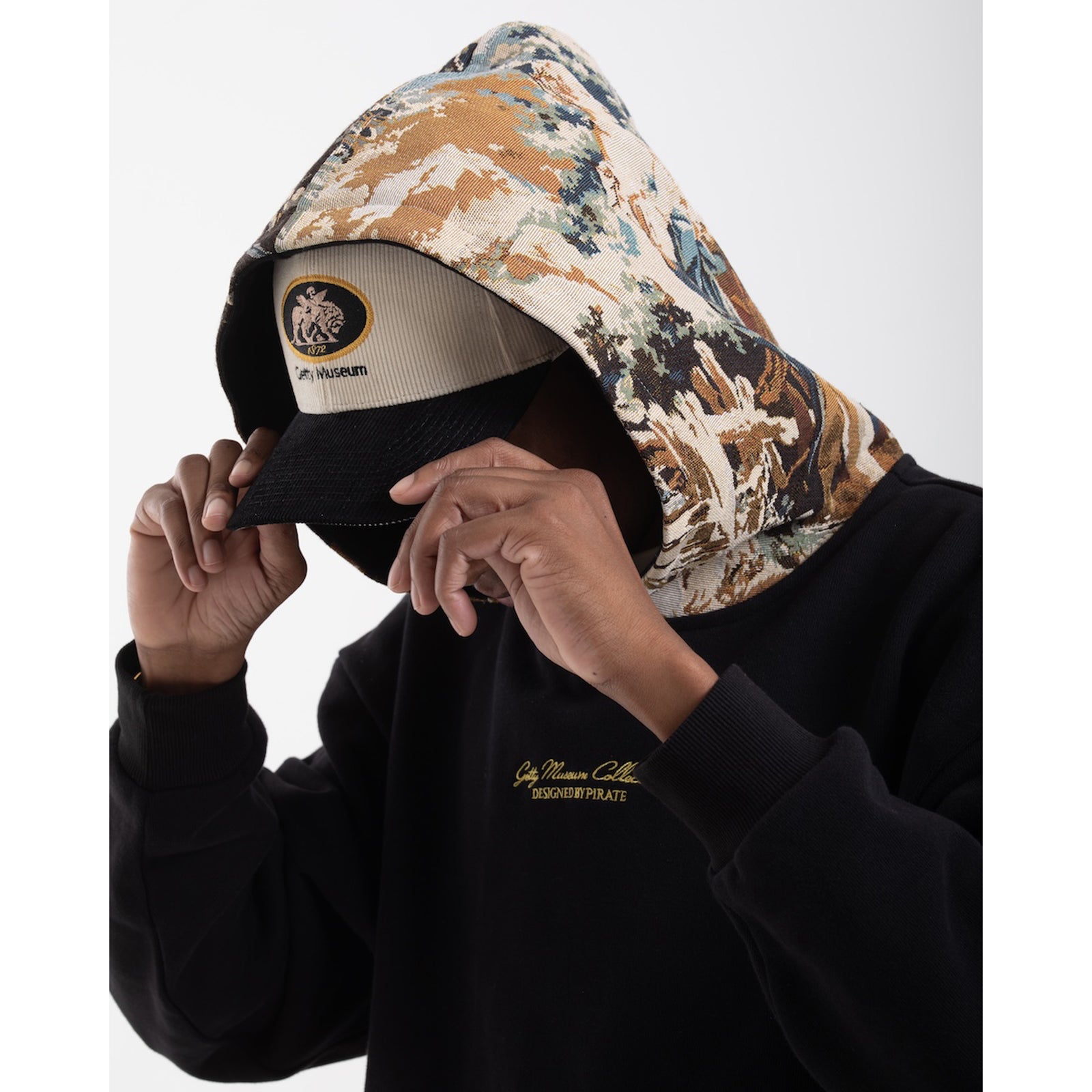 Black hoodie with a tapestry hood on a white background
