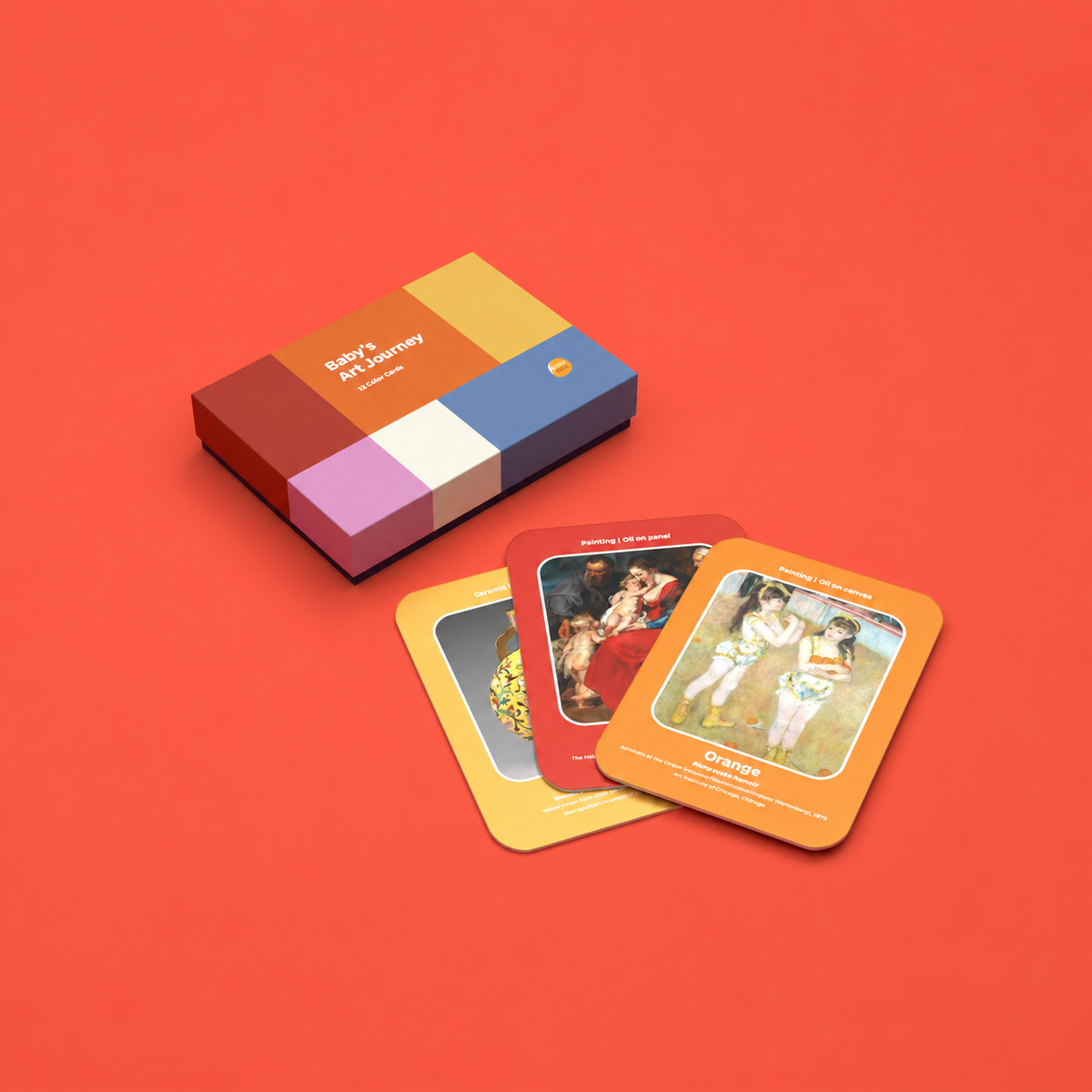 A boxed card game set titled "Baby's Art Journey" sits on a solid red background, with three colorful cards fanned out in front. The box and cards feature a retro color-blocked design in red, orange, yellow, blue, purple, and white, with vintage-style illustrations on the cards.