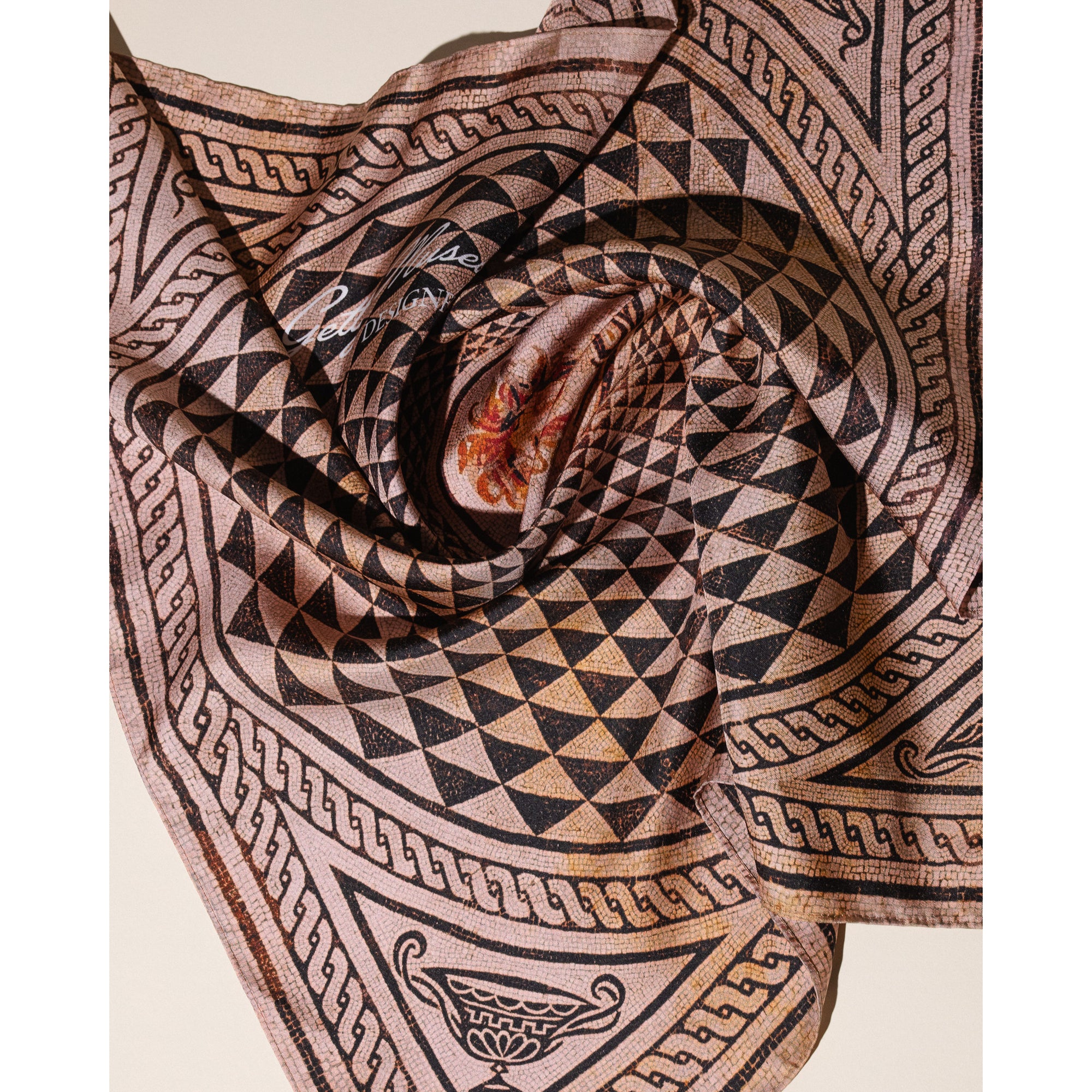 Silk bandana with geometric pattern and portrait on a white background