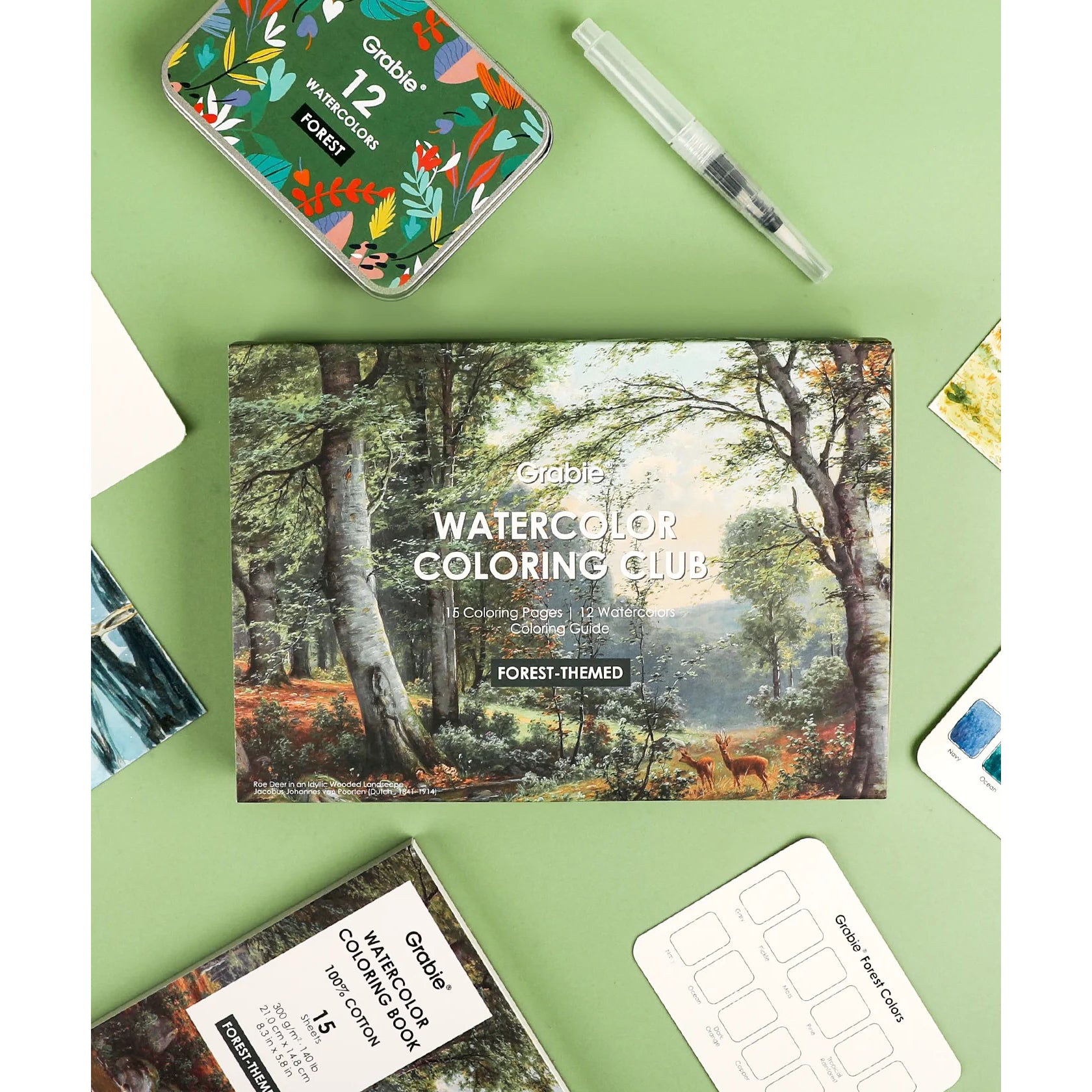 Coloring book titled 'Watercolor Coloring Club' with a forest-themed cover held by hands against a green background