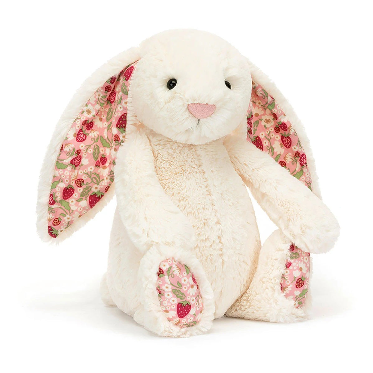 A plush bunny toy in cream-colored faux fur with long floppy ears and pink floral lining, sitting against a clean white background.