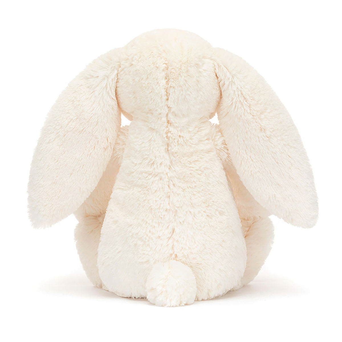 White plush bunny toy on a white background