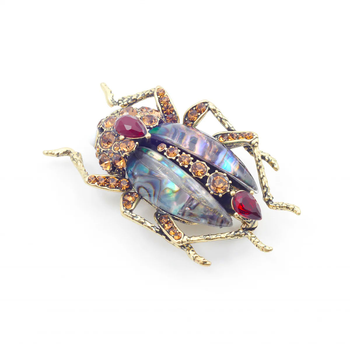 Decorative insect brooch with gemstones on a white background