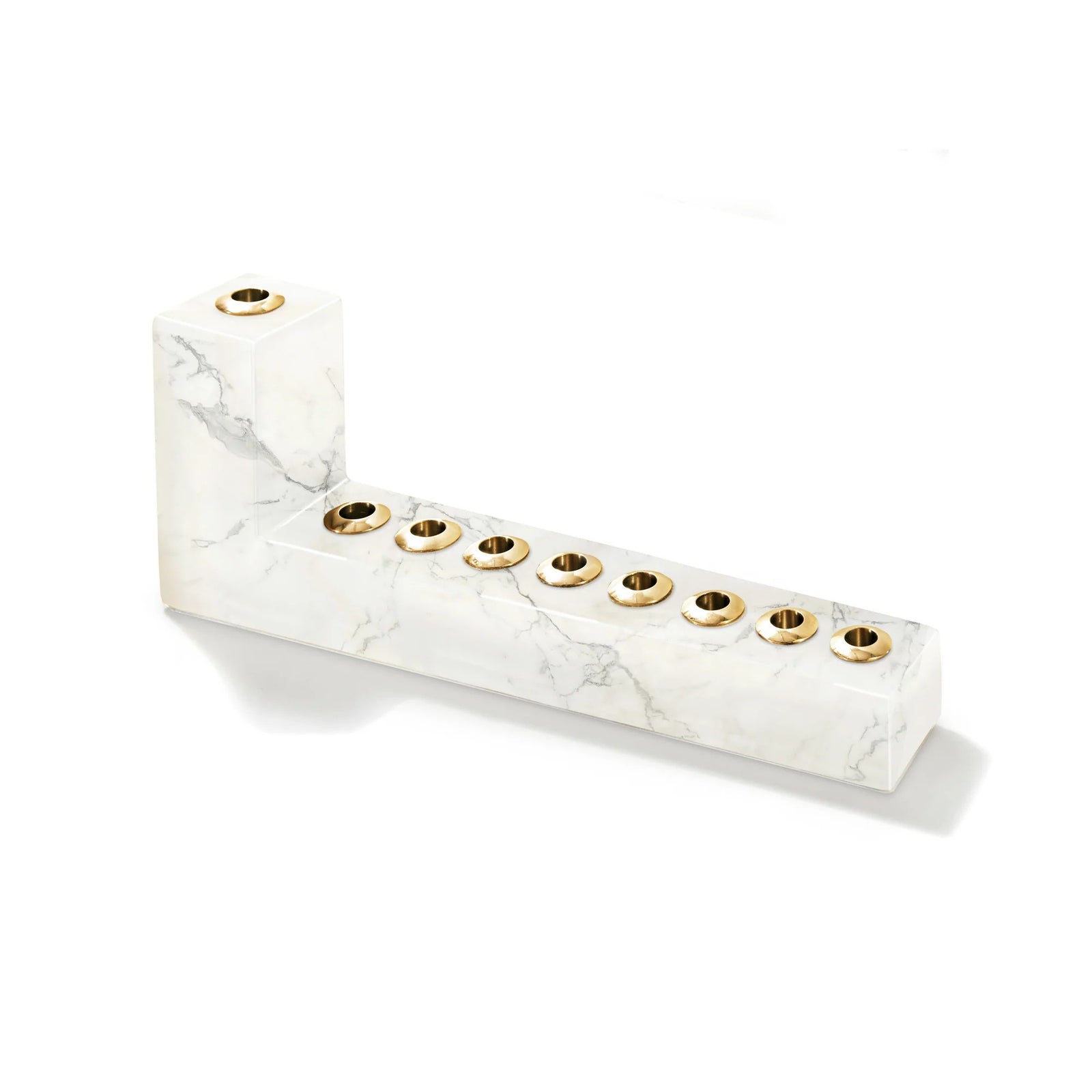 Marble-patterned candle holder with gold accents on a white background