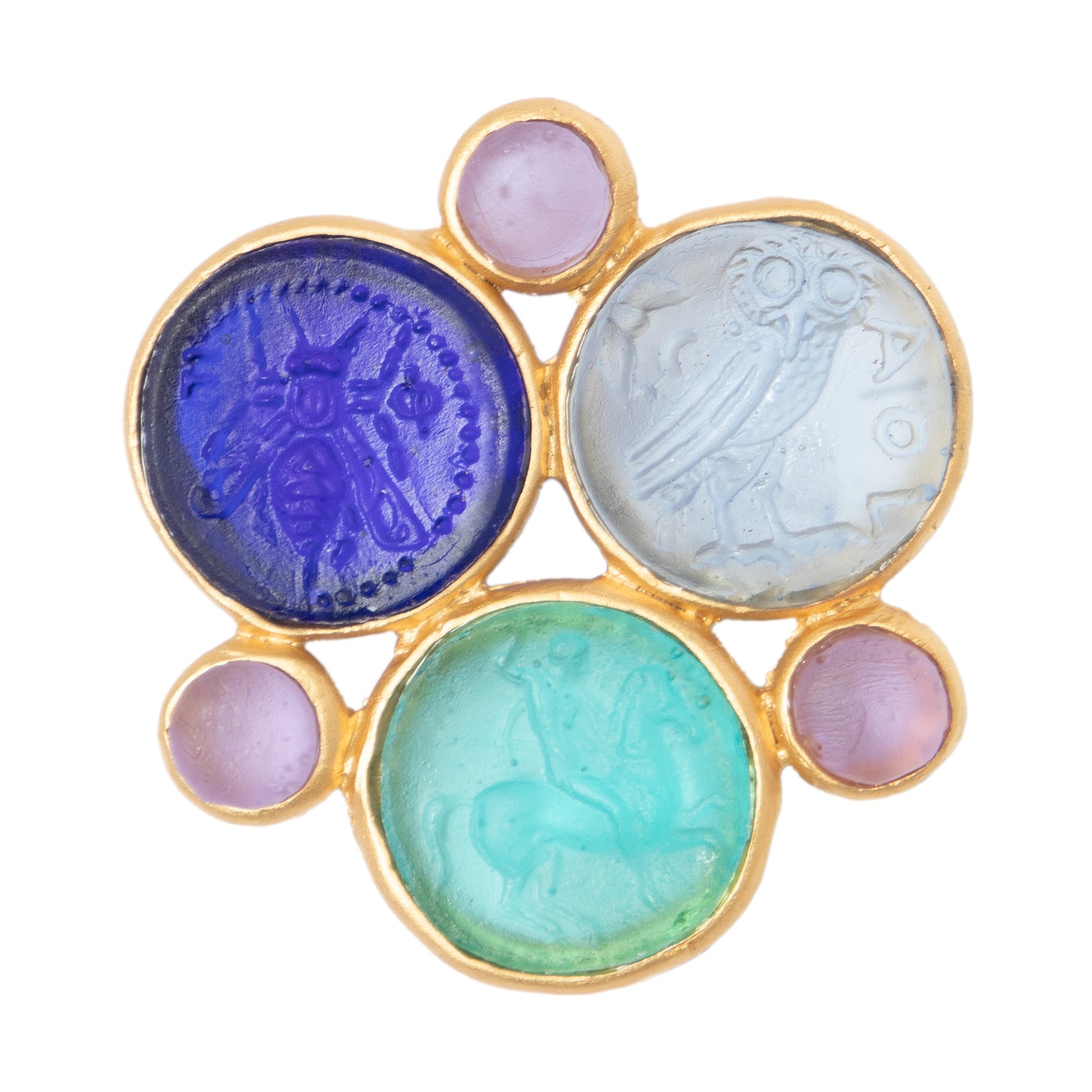 A glass multi-coin brooch with vibrant blue, green, and purple colors, featuring intricate embossed designs resembling coins, surrounded by a gold-tone metal frame.