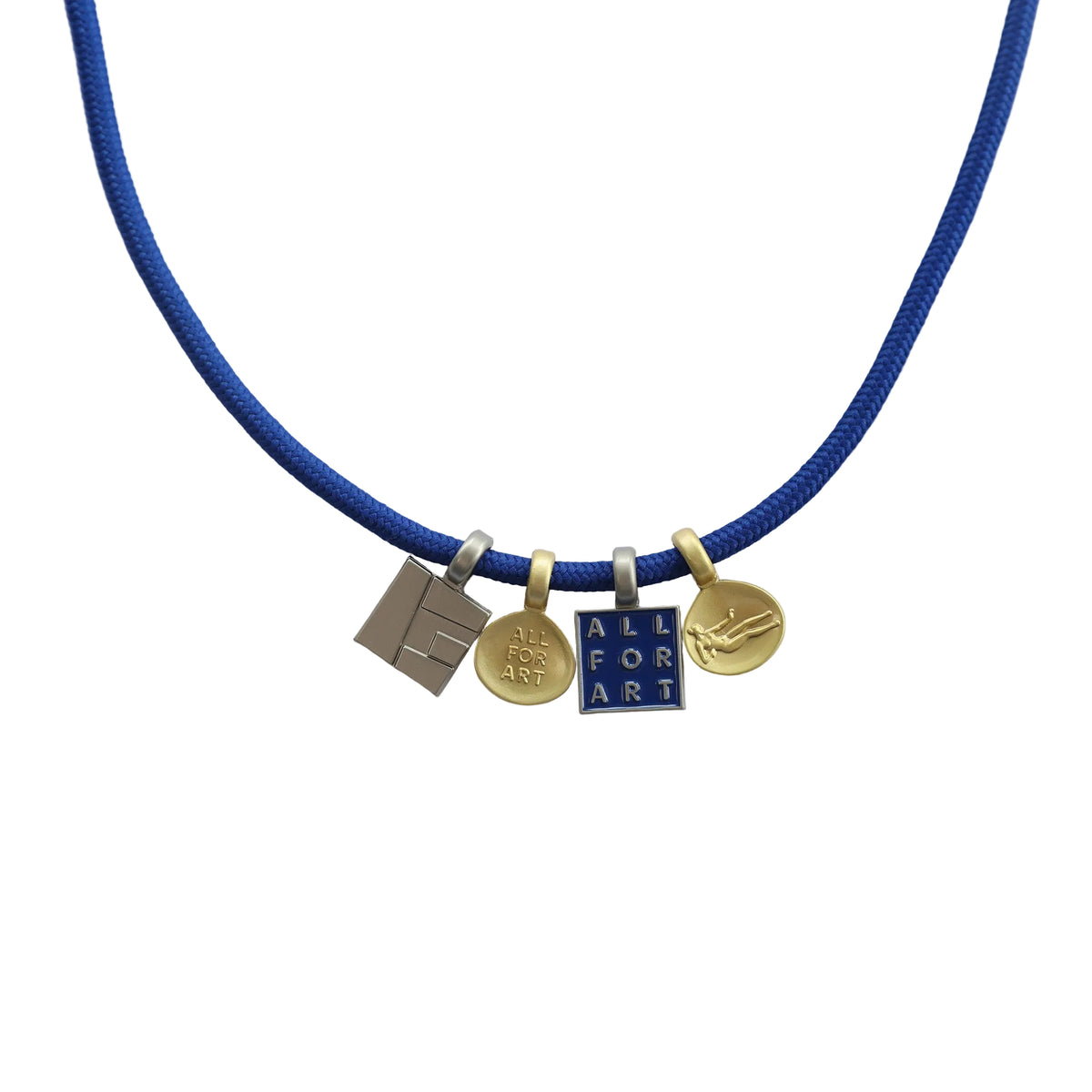A blue cord necklace with four small charms, including a silver geometric piece, a gold circular charm with a crest, a blue and gold square charm reading 'ALL FOR ART', and a gold circular charm with a bird, displayed on a light gray background.