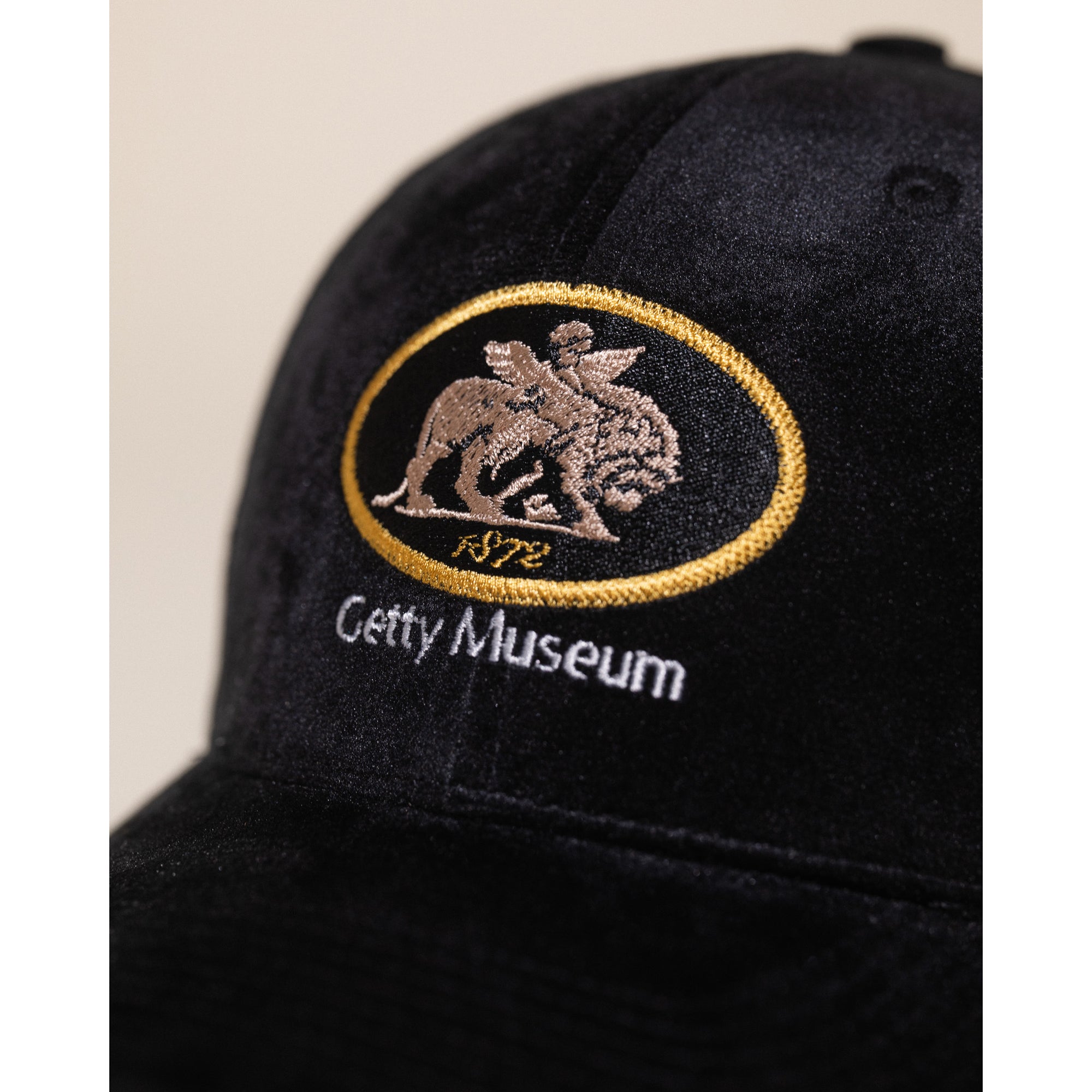Black cap with Getty Museum written under an art piece on a white background