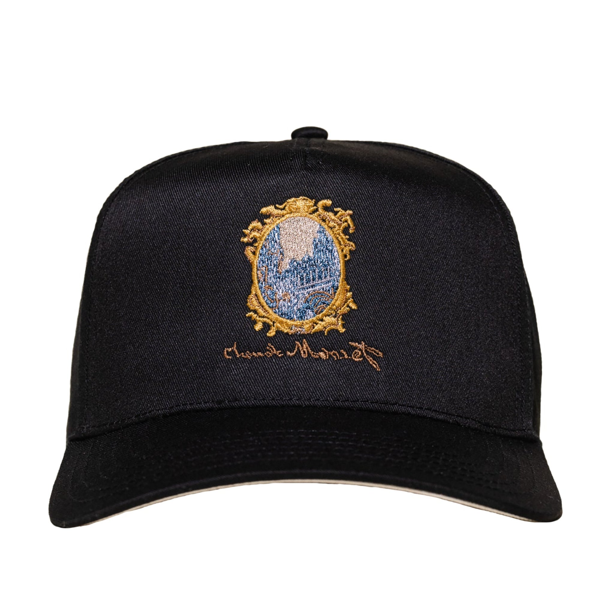 Black cap with embroidered design on a white background