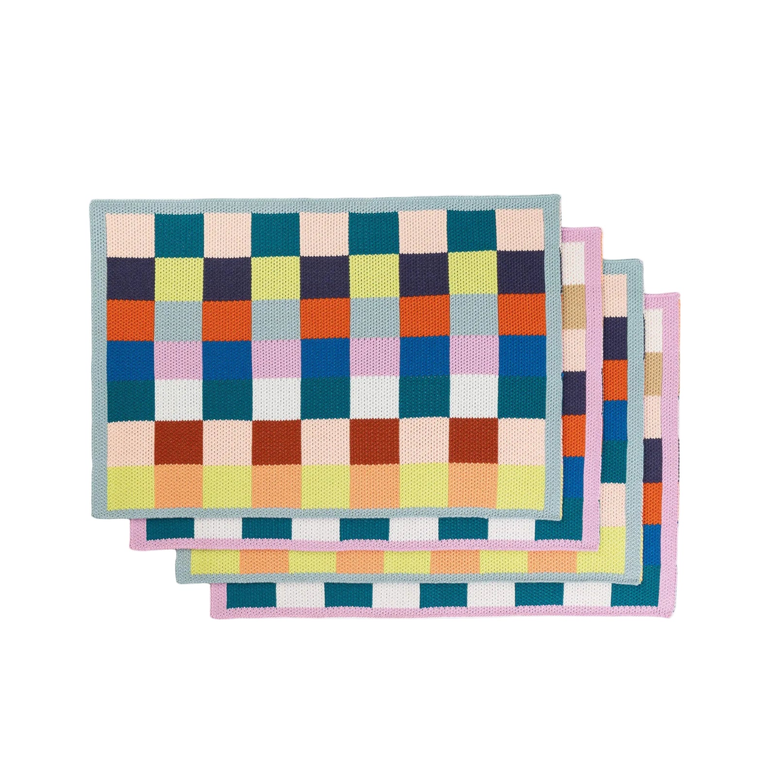 Set of colorful checkered placemats on a white background