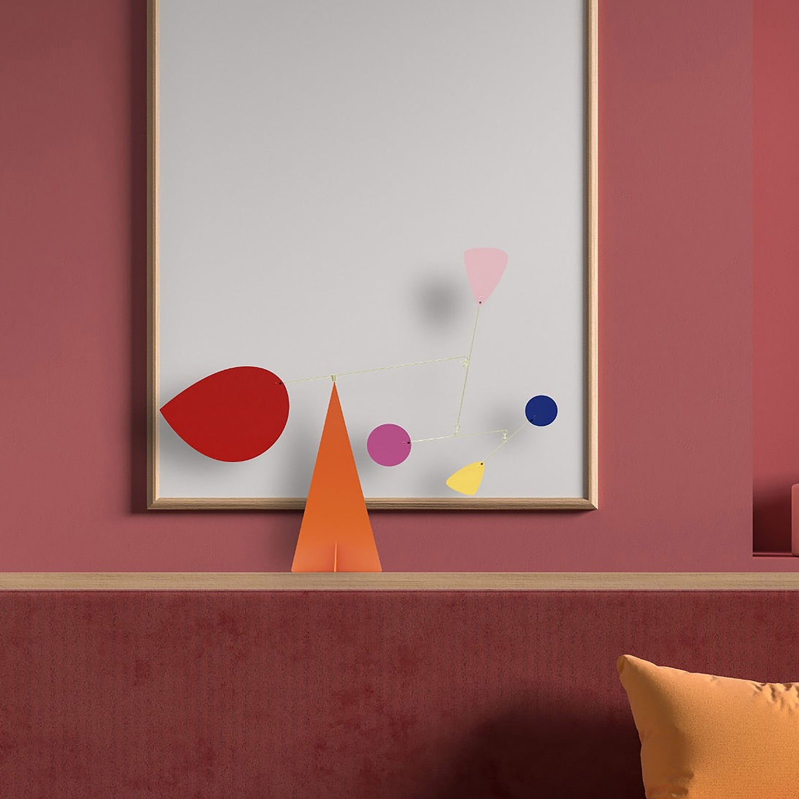 Colorful mobile against a pink room