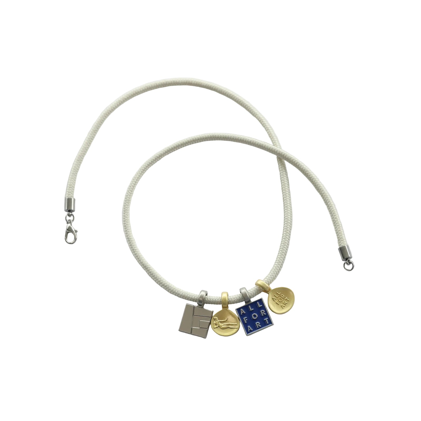 A cream-colored braided cord bracelet with three small charms: a silver rectangular charm, a gold circular charm with a bird design, and a blue square charm with gold lettering, displayed on a clean white background.