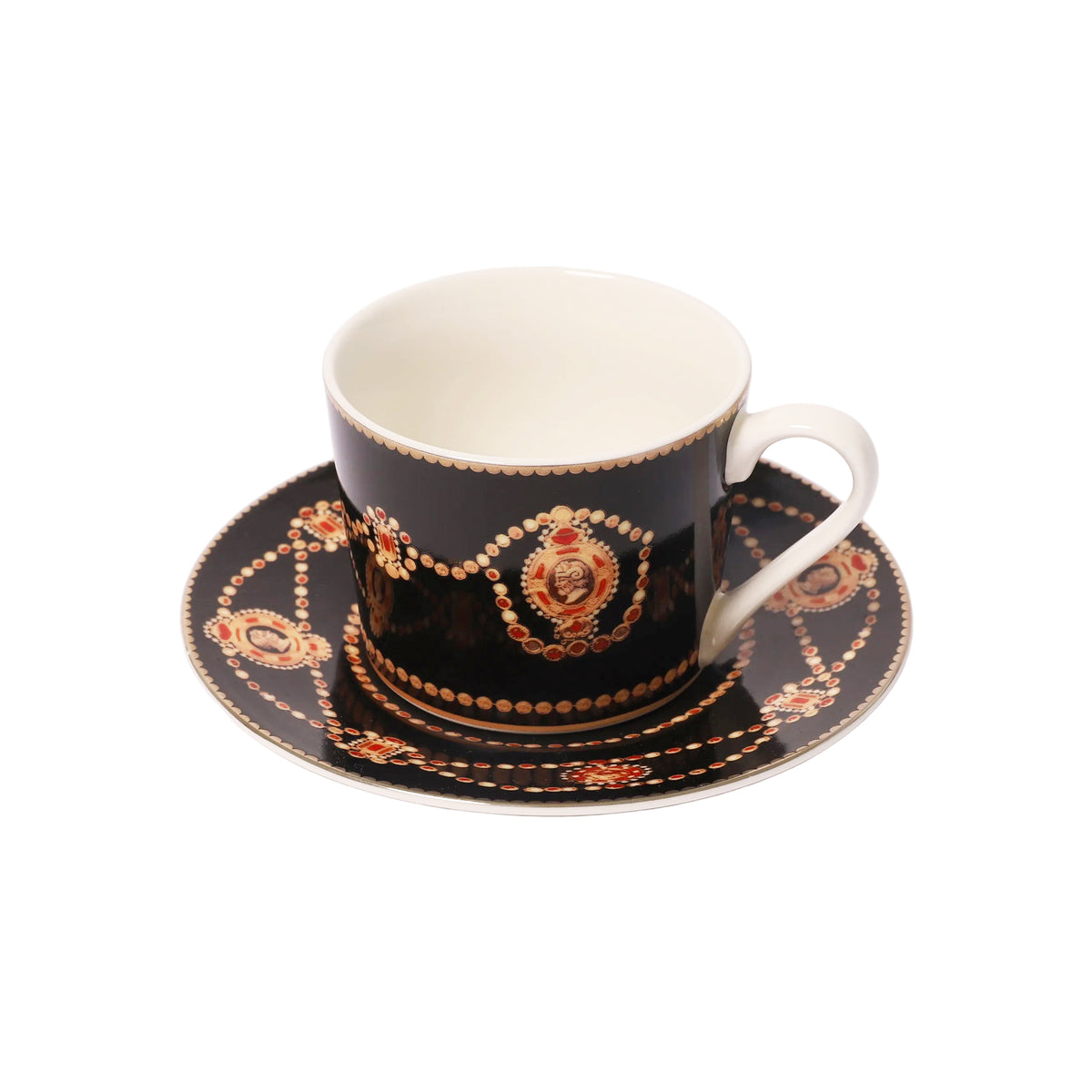 A black porcelain teacup and saucer set with ornate gold and red decorative patterns, photographed on a clean white background.
