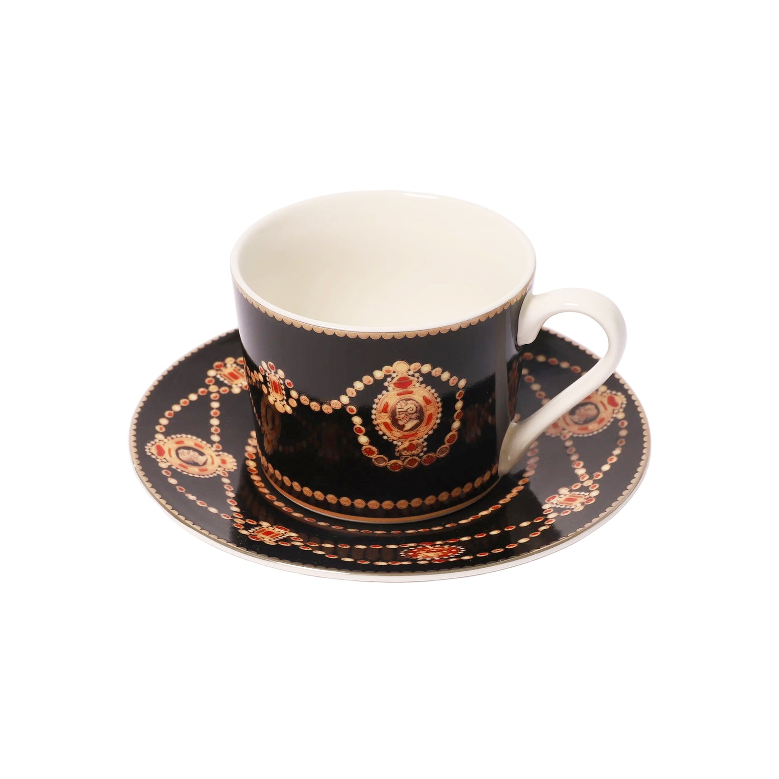 A black porcelain teacup and saucer set with ornate gold and red decorative patterns, photographed on a clean white background.