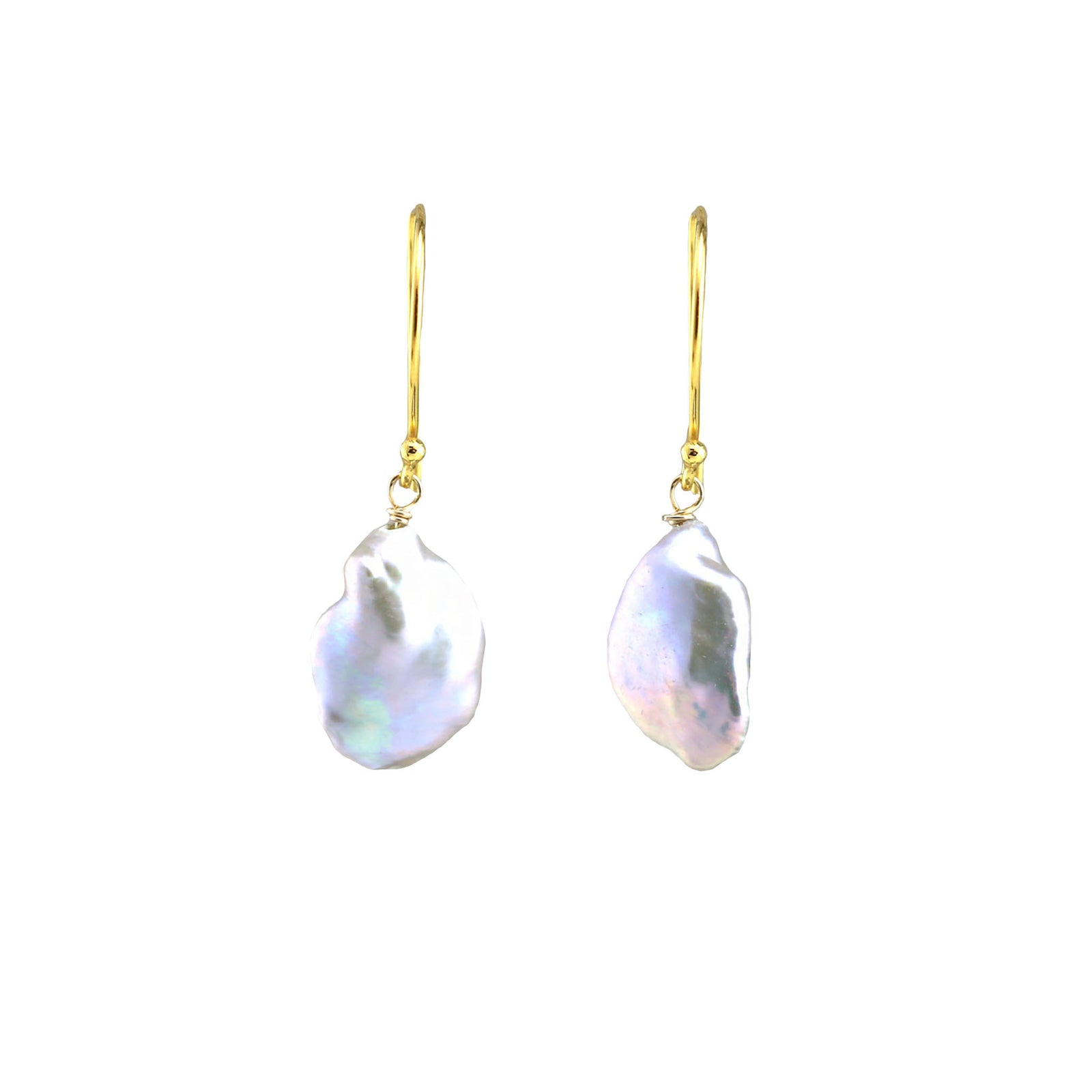 Pearl drop earrings with gold hooks on a white background