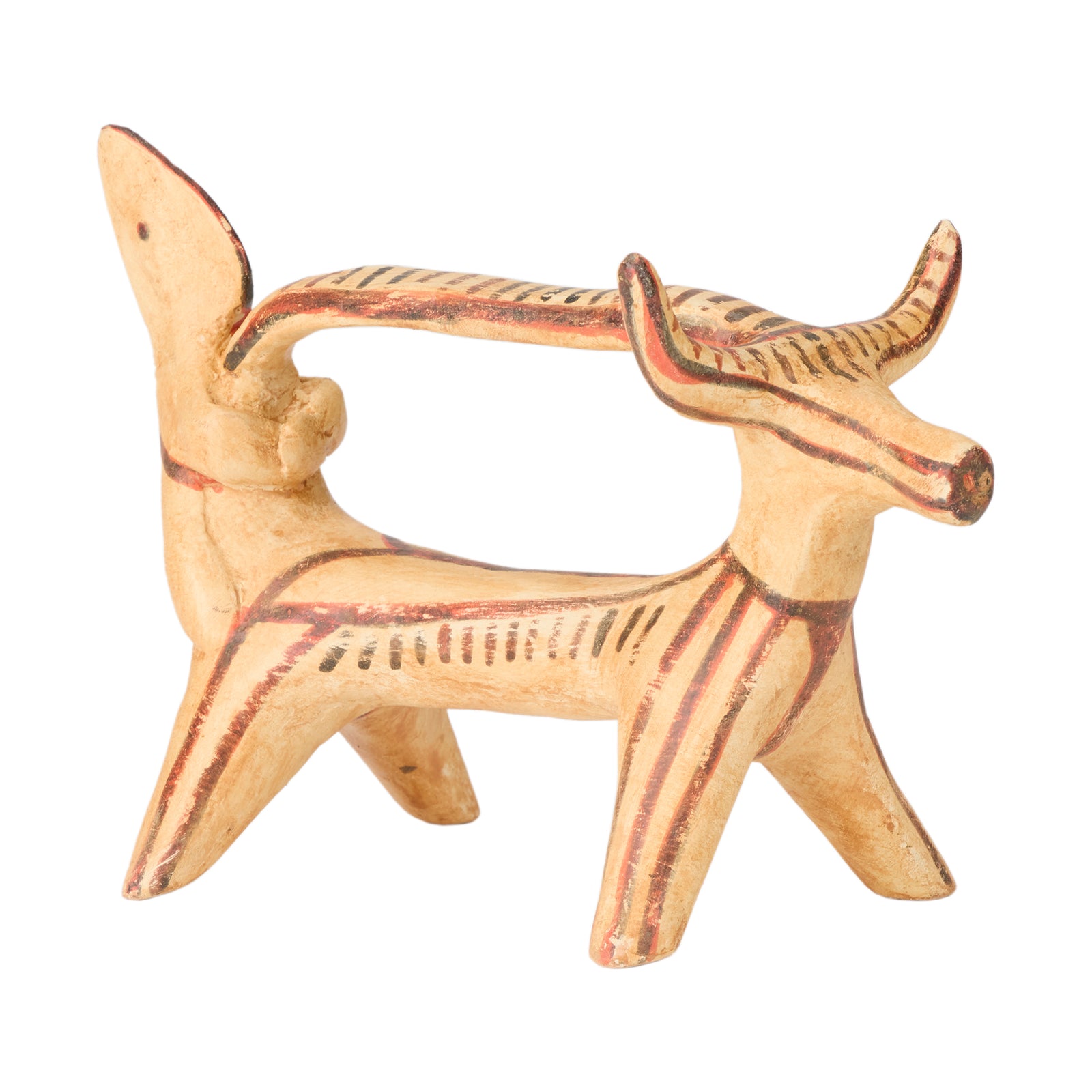 Ceramic figurine of a creature with large horns on a white background